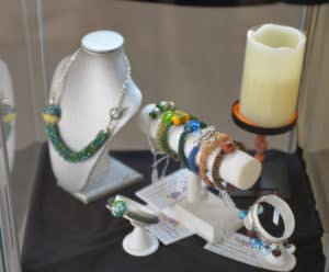 Colorful bracelets and necklace on display by Connie Wahl