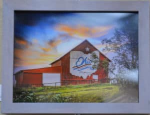 Photo of red barn with the state of ohio painted in white on its side by michelle wittensoldner