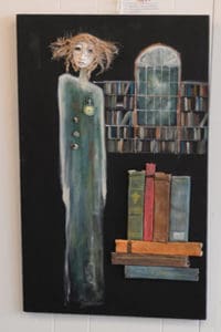 mixed media art work of woman with books by peggy sibila