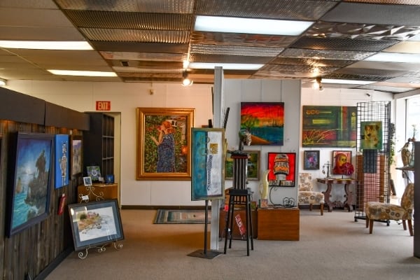 Image of Tuscarawas Art Co-op gallery interior featuring paintings and sculptures