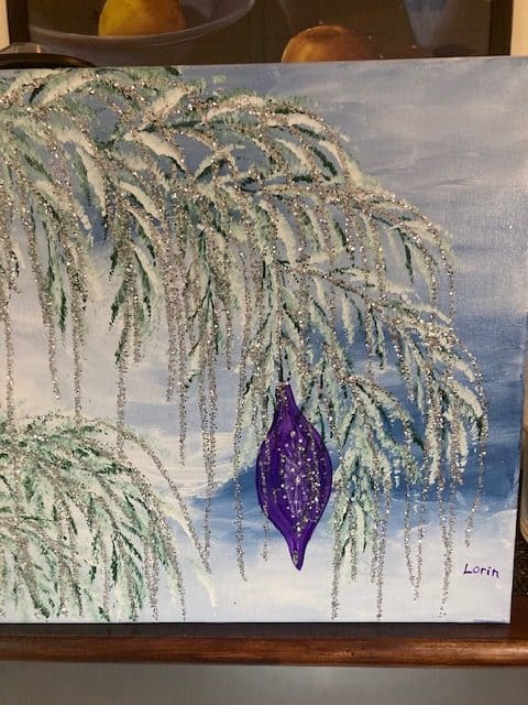 Painting of snowy tree with purple ornament hanging from branch