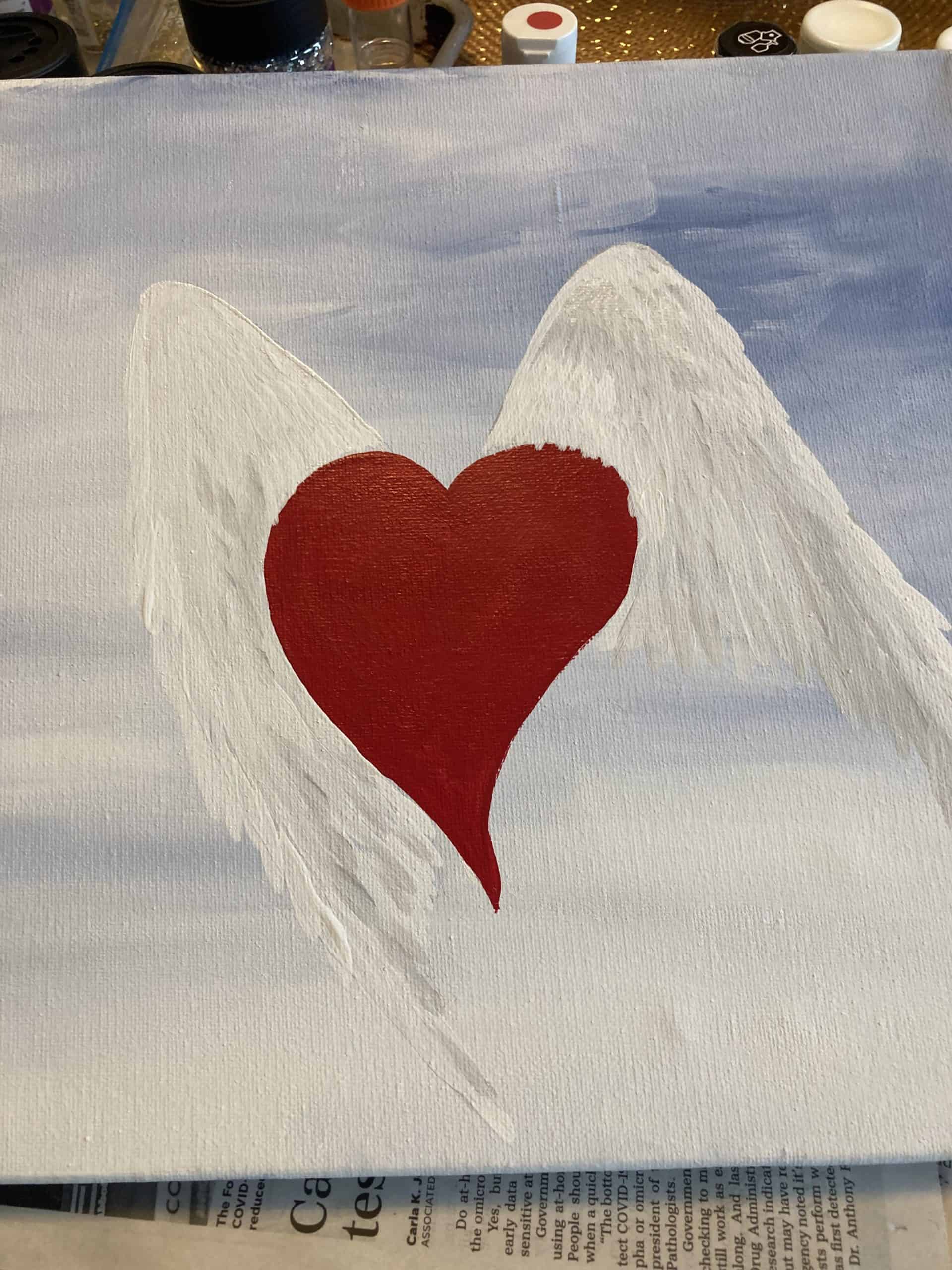 Painting of wings with a heart